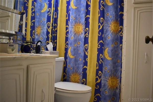 a bathroom with a toilet and a sink