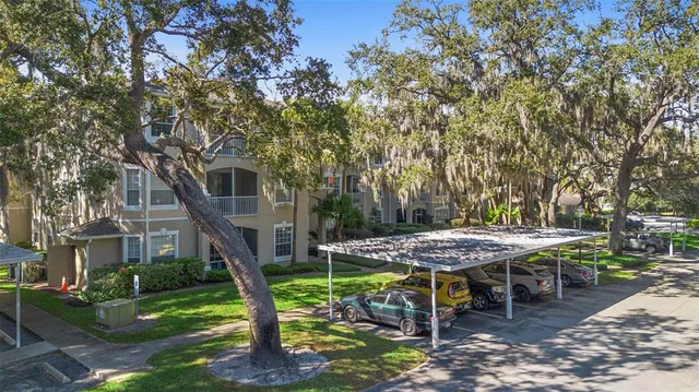 a view of a house with backyard porch and sitting area
