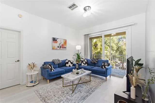 a kitchen with stainless steel appliances a sink stove and cabinets