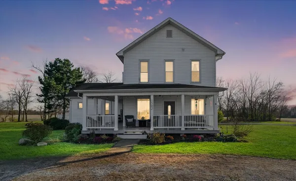 a view of house with yard
