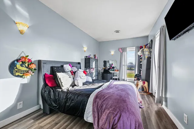 a living room with furniture fireplace and flat screen tv