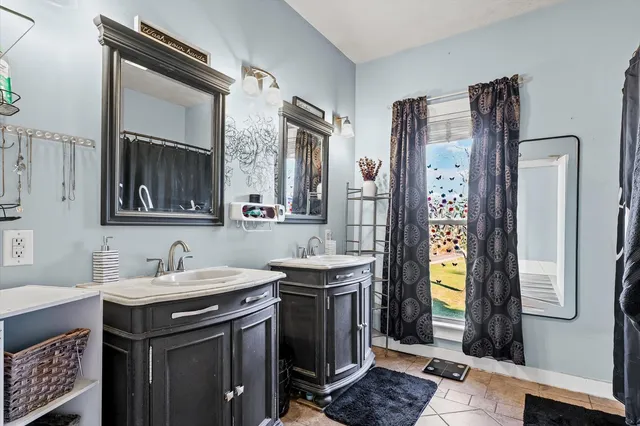 a bathroom with a sink and a mirror