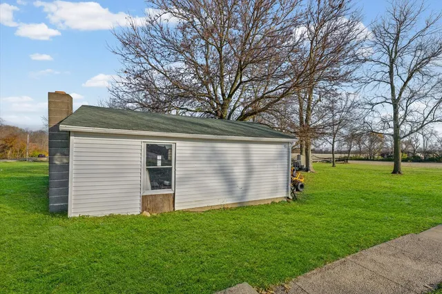 a front view of house with garden
