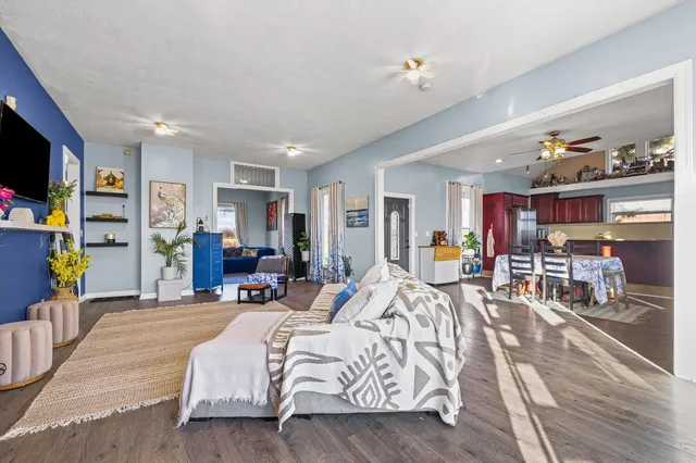 a bed room with furniture and a flat screen tv