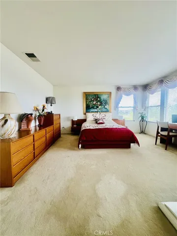 a living room with furniture and a lamp