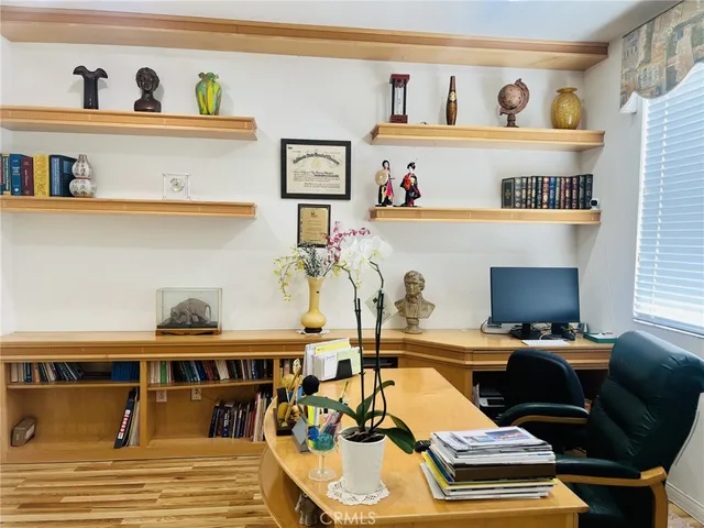 a view of a workspace with furniture