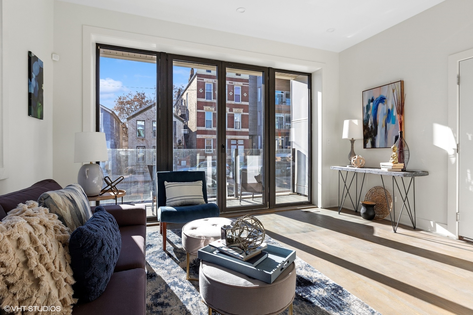 718-720 West 17th Street, Unit 1E Chicago, IL 60616 - Photo 2 of 28 a living room with furniture and a floor to ceiling window