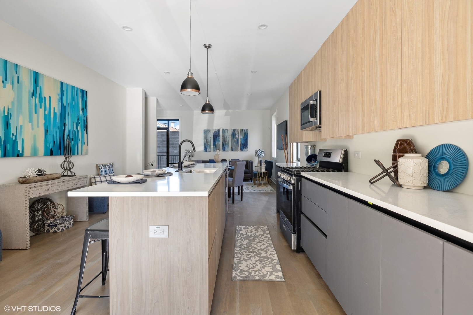 718-720 West 17th Street, Unit 1E Chicago, IL 60616 - Photo 7 of 28 a large kitchen with kitchen island a sink stove and cabinets
