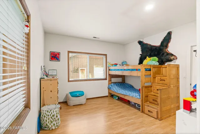 a bedroom with furniture and a bed