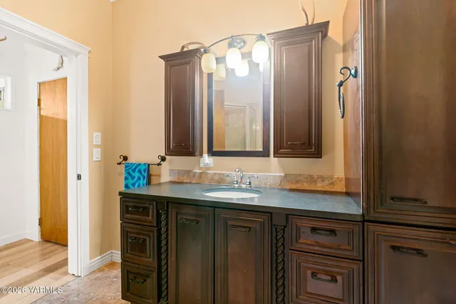 a bathroom with a sink and a mirror
