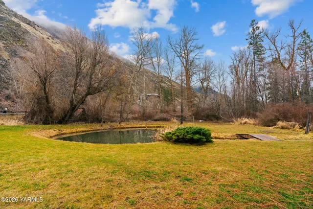 a view of a swimming pool with an outdoor space and seating area
