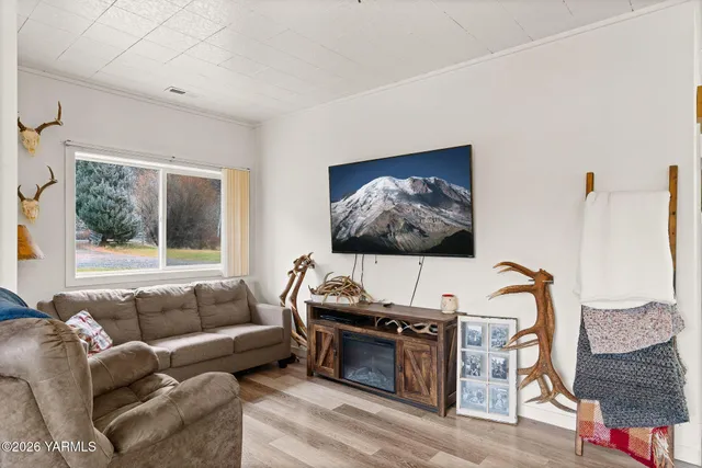 a living room with furniture and window