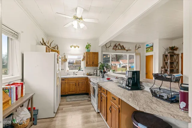 a kitchen with refrigerator and stove