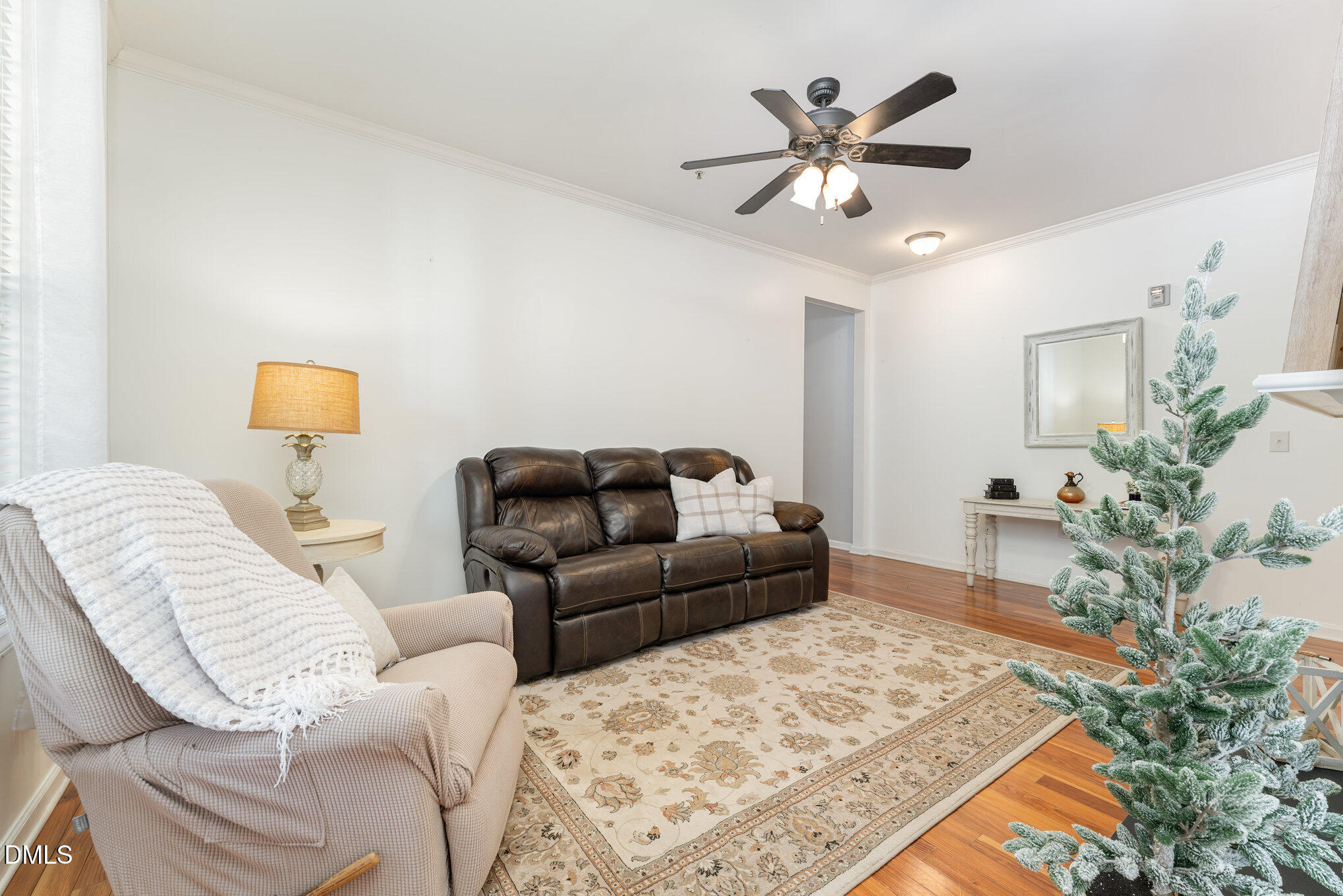 8231 Allyns Landing Way, Unit 101 Raleigh, NC 27615 - Photo 16 of 25 a living room with furniture and wooden floor