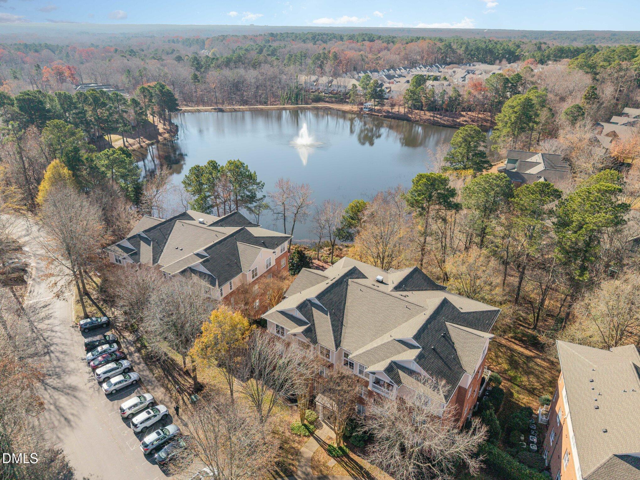 8231 Allyns Landing Way, Unit 101 Raleigh, NC 27615 - Photo 2 of 25 an aerial view of a house with a lake view