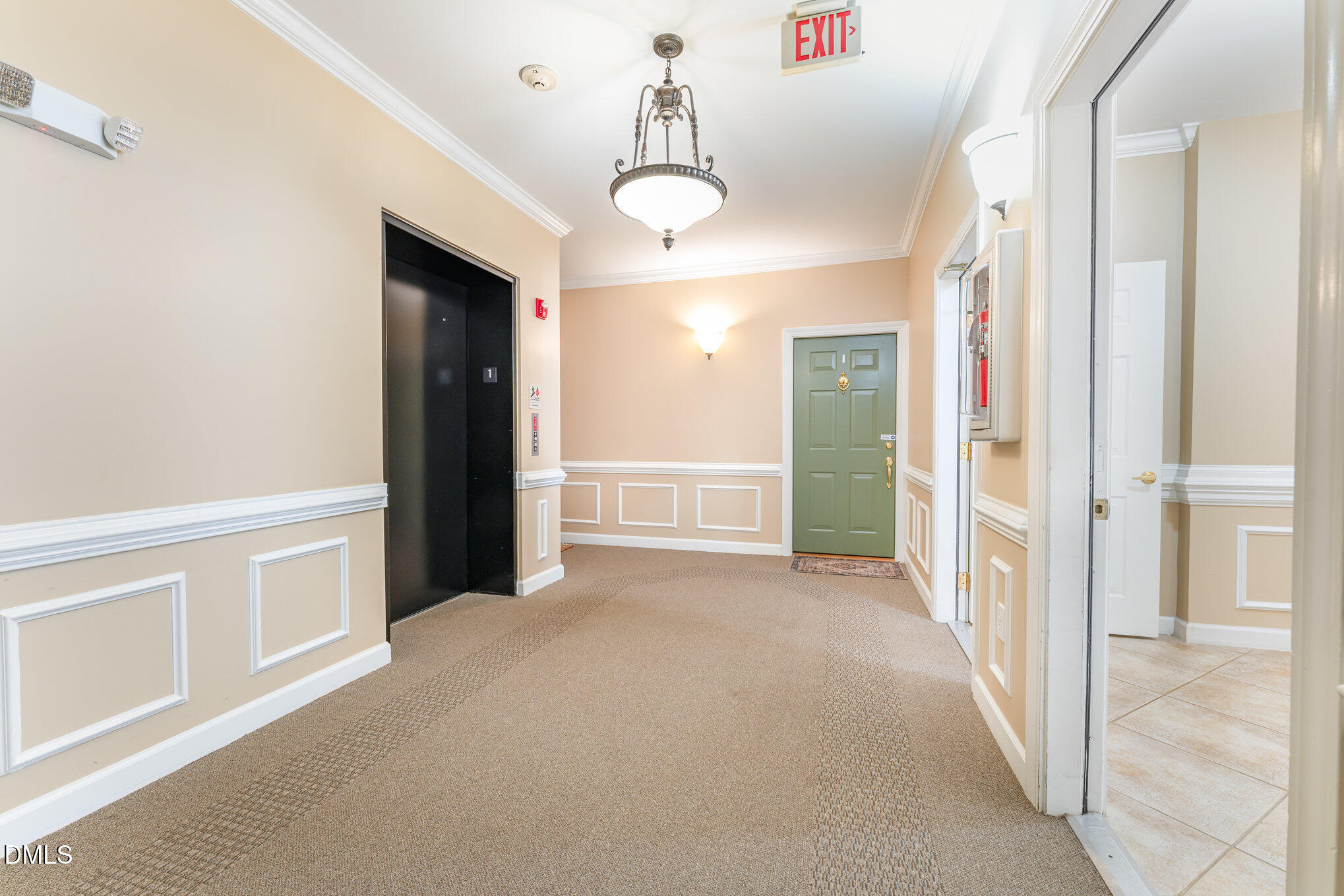 8231 Allyns Landing Way, Unit 101 Raleigh, NC 27615 - Photo 24 of 25 a view of a hallway with wooden floor and windows