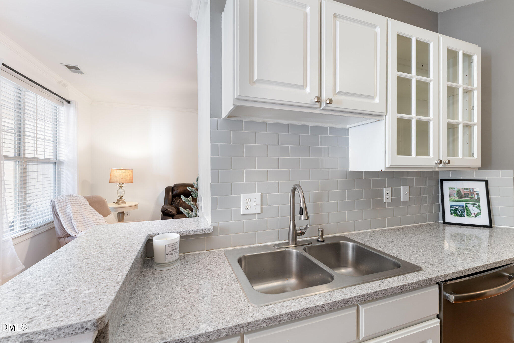 8231 Allyns Landing Way, Unit 101 Raleigh, NC 27615 - Photo 10 of 25 a kitchen with a sink and cabinets