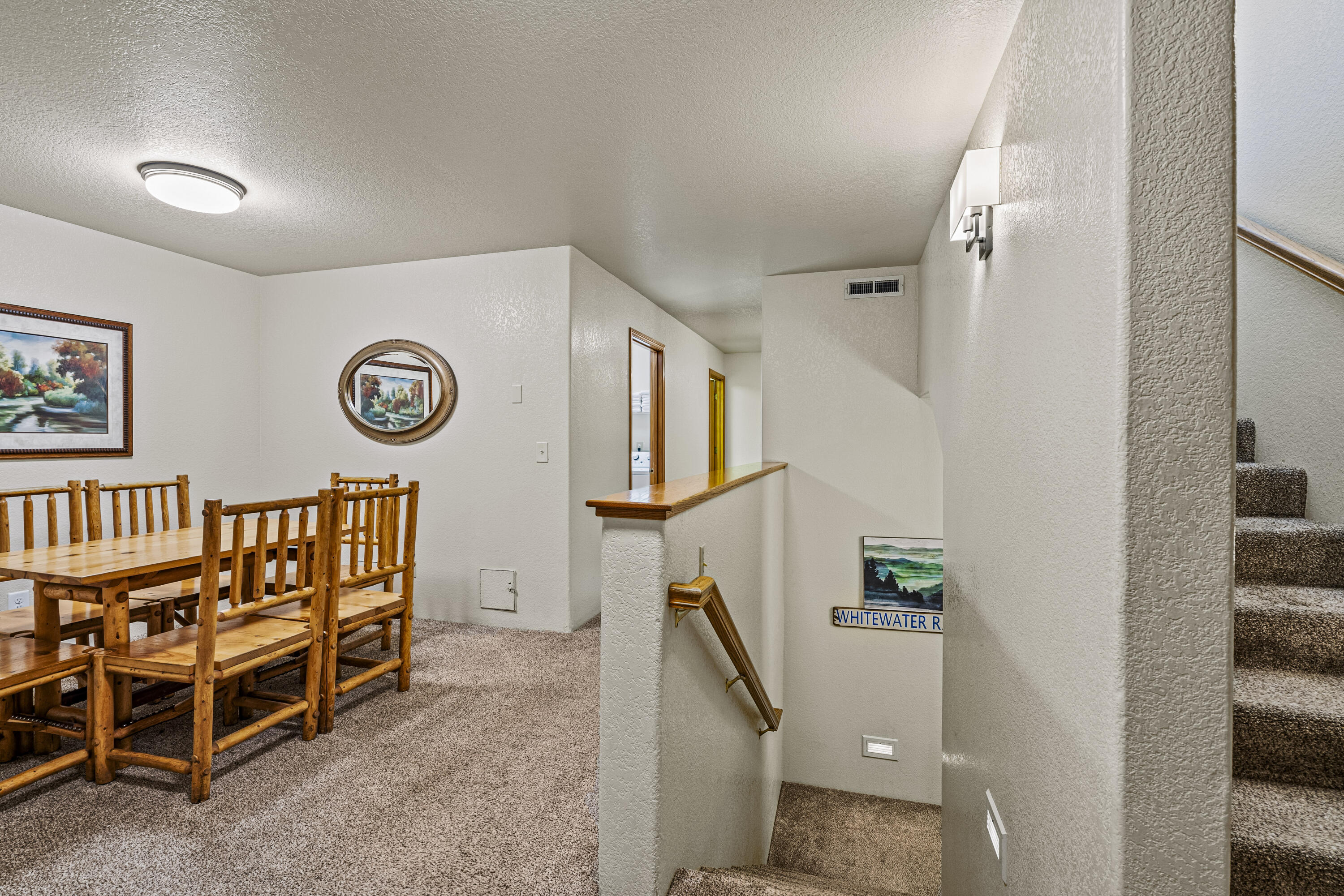11744 Galice Road Merlin, OR 97532 - Photo 28 of 74 a view of a hallway with entryway windows stairs and a way to kitchen