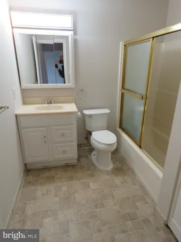 a bathroom with a toilet and a sink