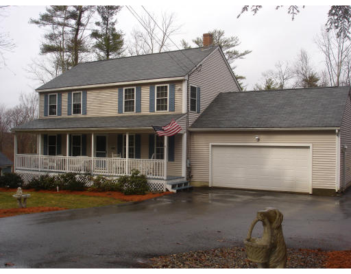 a front view of a house with yard