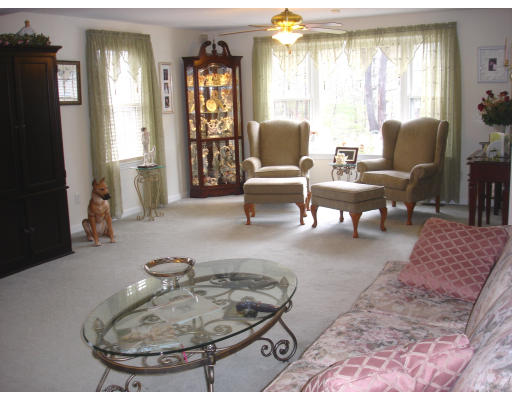 96 Mashapaug Road Sturbridge, MA 01566 - Photo 11 of 30 a living room with furniture and a window