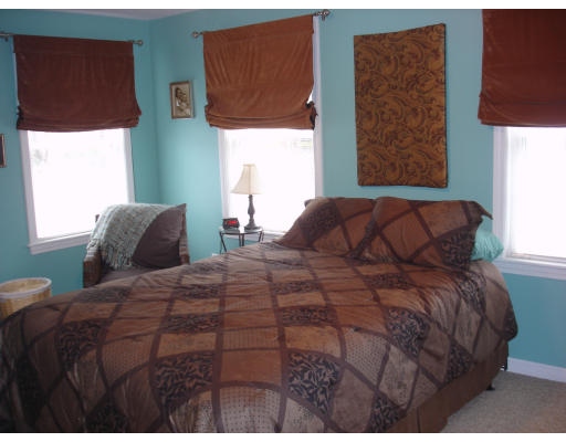 96 Mashapaug Road Sturbridge, MA 01566 - Photo 15 of 30 a bedroom with a bed and window