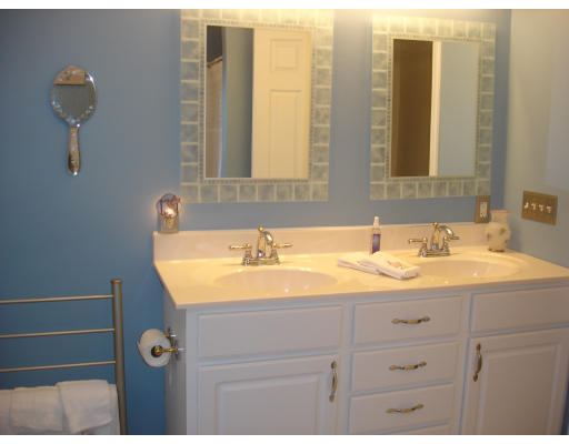 96 Mashapaug Road Sturbridge, MA 01566 - Photo 17 of 30 a bathroom with a sink and a mirror