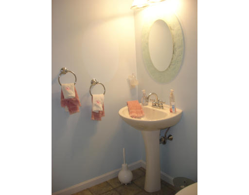 96 Mashapaug Road Sturbridge, MA 01566 - Photo 20 of 30 a bathroom with a sink and a mirror