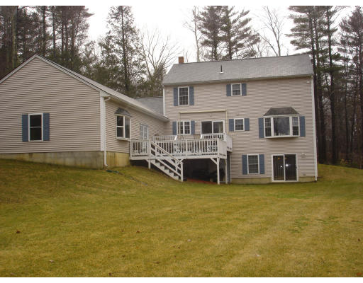 96 Mashapaug Road Sturbridge, MA 01566 - Photo 26 of 30 a view of a house with patio yard and a tree