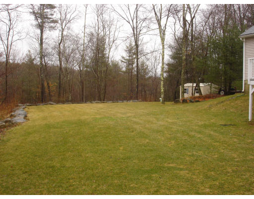 96 Mashapaug Road Sturbridge, MA 01566 - Photo 30 of 30 a view of a field with trees in the background