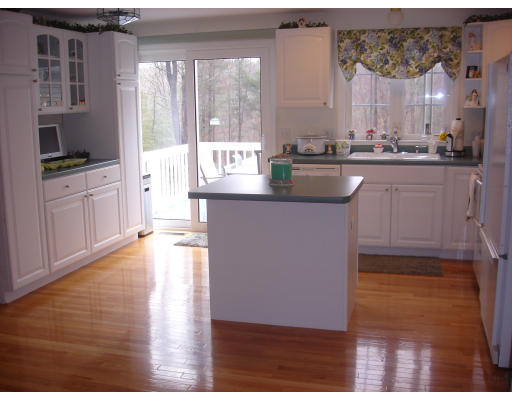 96 Mashapaug Road Sturbridge, MA 01566 - Photo 5 of 30 a kitchen with stainless steel appliances granite countertop a stove a sink and a microwave