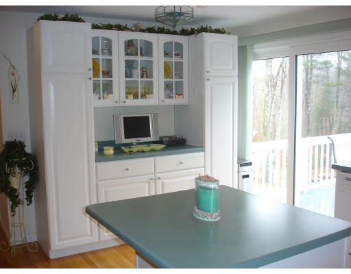 96 Mashapaug Road Sturbridge, MA 01566 - Photo 7 of 30 a kitchen with a table chairs and a view of living room