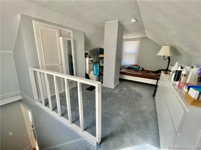 a view of a livingroom with an empty space and a window