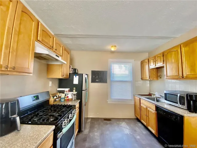 a view of a dining room with furniture and window