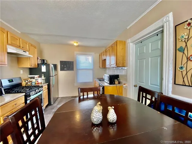 a bedroom with a bed and a closet with mirror