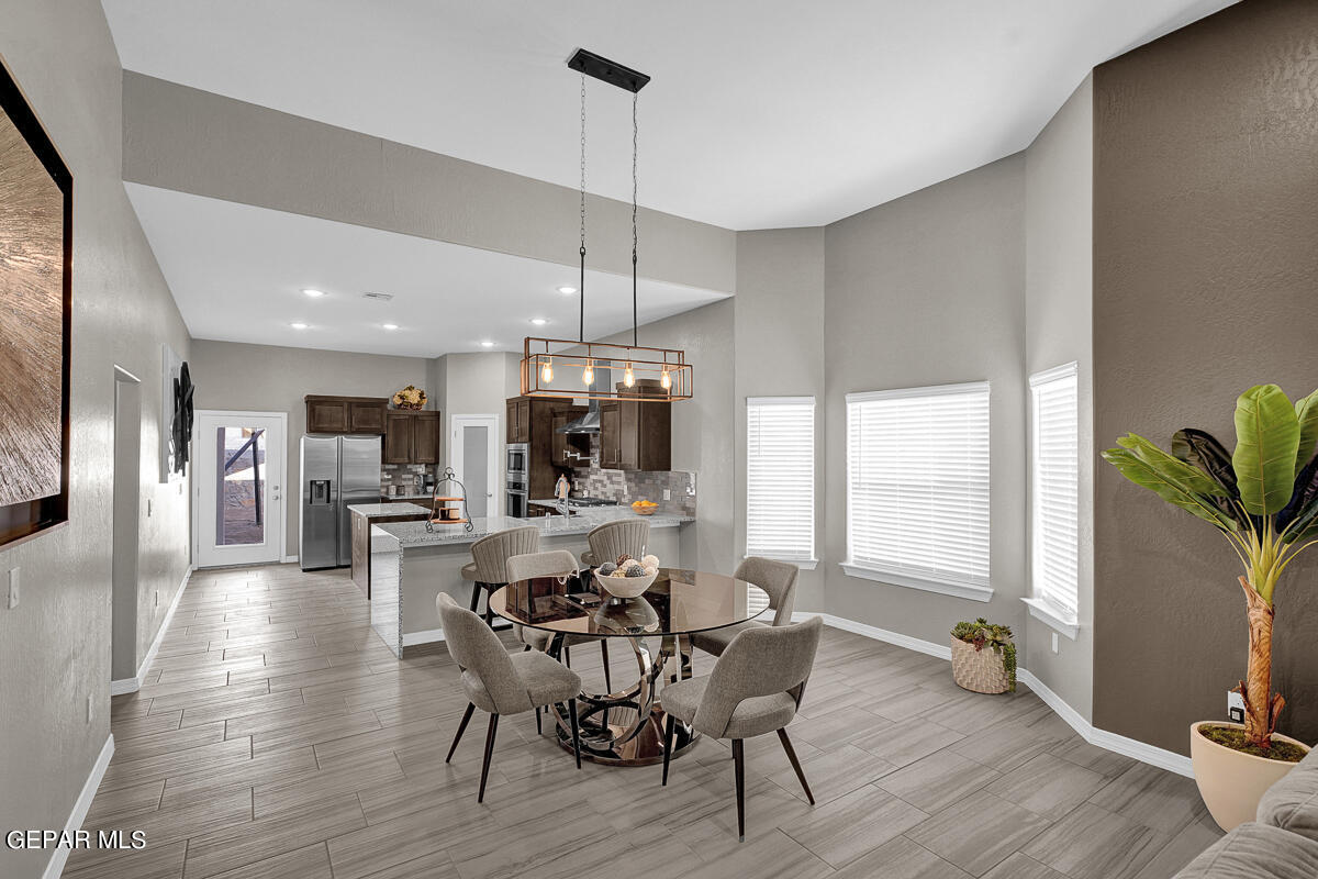15113 Conviction El Paso, TX 79938 - Photo 11 of 42 a view of a dining room with furniture window and wooden floor