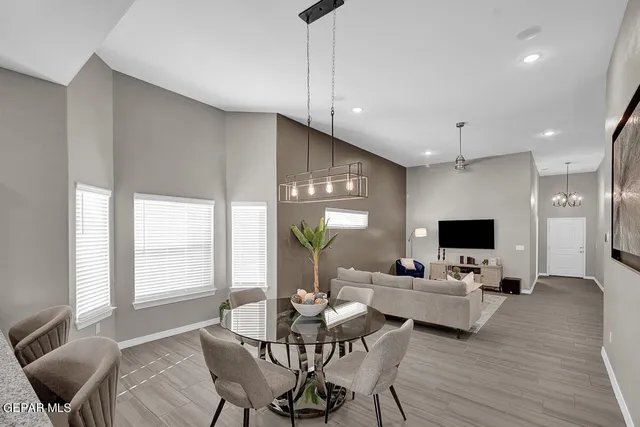 a living room with fireplace furniture and a flat screen tv