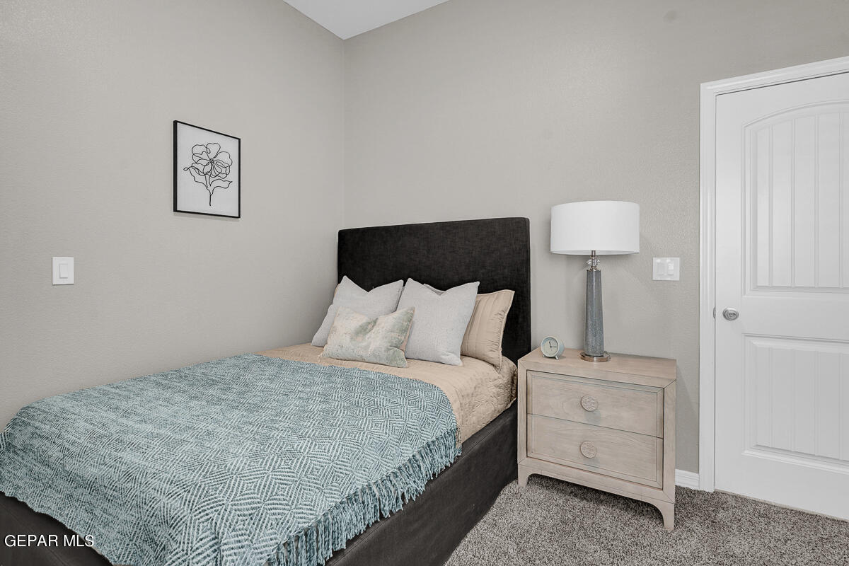 15113 Conviction El Paso, TX 79938 - Photo 24 of 42 a bed room with a bed and a night stand