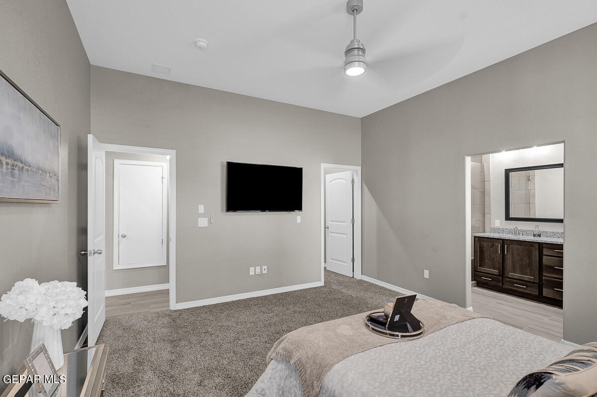 15113 Conviction El Paso, TX 79938 - Photo 31 of 42 a bedroom with a bed and a flat screen tv