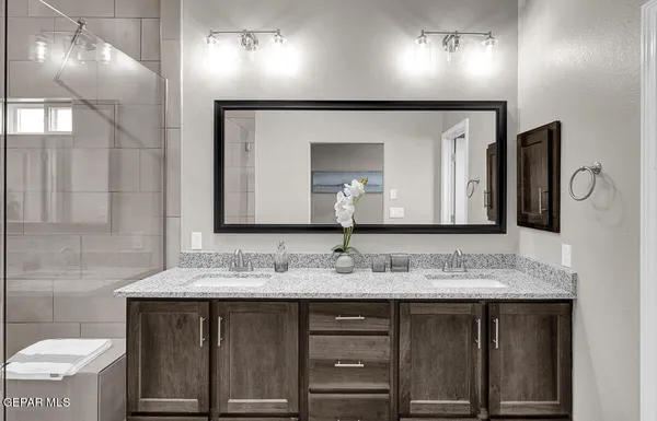 a bathroom with a sink and a mirror