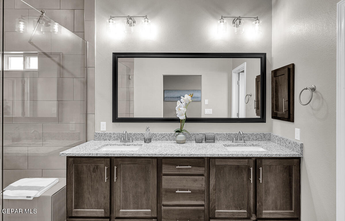 15113 Conviction El Paso, TX 79938 - Photo 32 of 42 a bathroom with a sink and a mirror