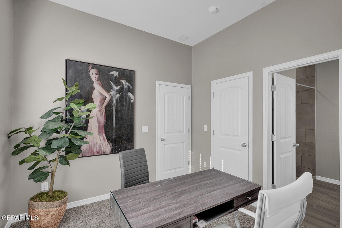 15113 Conviction El Paso, TX 79938 - Photo 39 of 42 a living room with furniture potted plant and wooden floor
