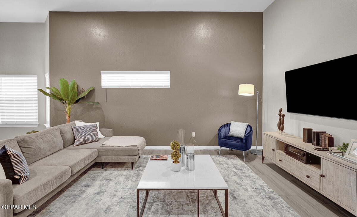 15113 Conviction El Paso, TX 79938 - Photo 4 of 42 a living room with furniture and a flat screen tv