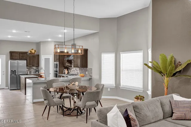 a view of a dining room with furniture window and outside view
