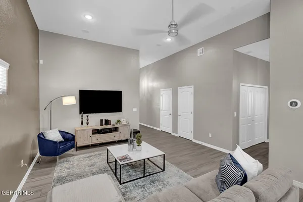 a living room with furniture and a flat screen tv