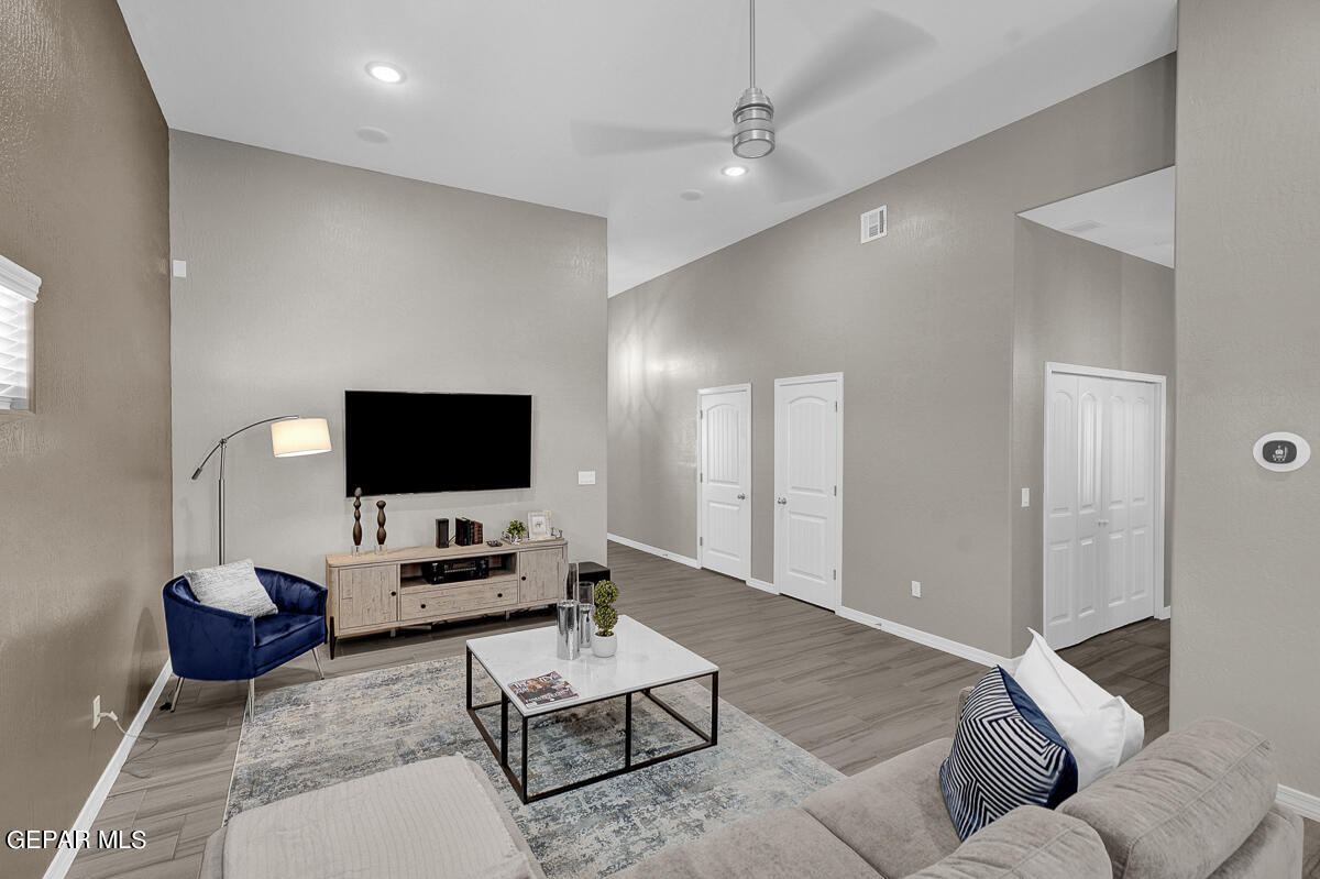 15113 Conviction El Paso, TX 79938 - Photo 8 of 42 a living room with furniture and a flat screen tv