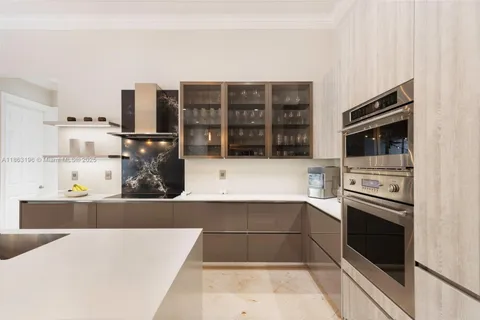 a kitchen with stainless steel appliances a stove and a refrigerator