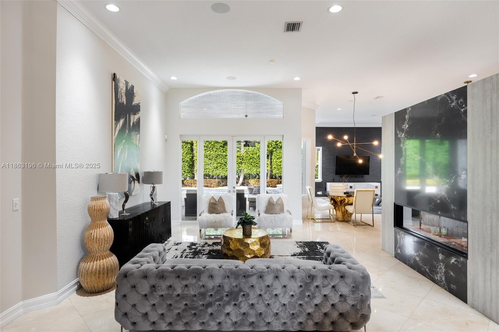 9445 Southwest 68th Street Miami, FL 33173 - Photo 11 of 41 a living room with furniture and a flat screen tv