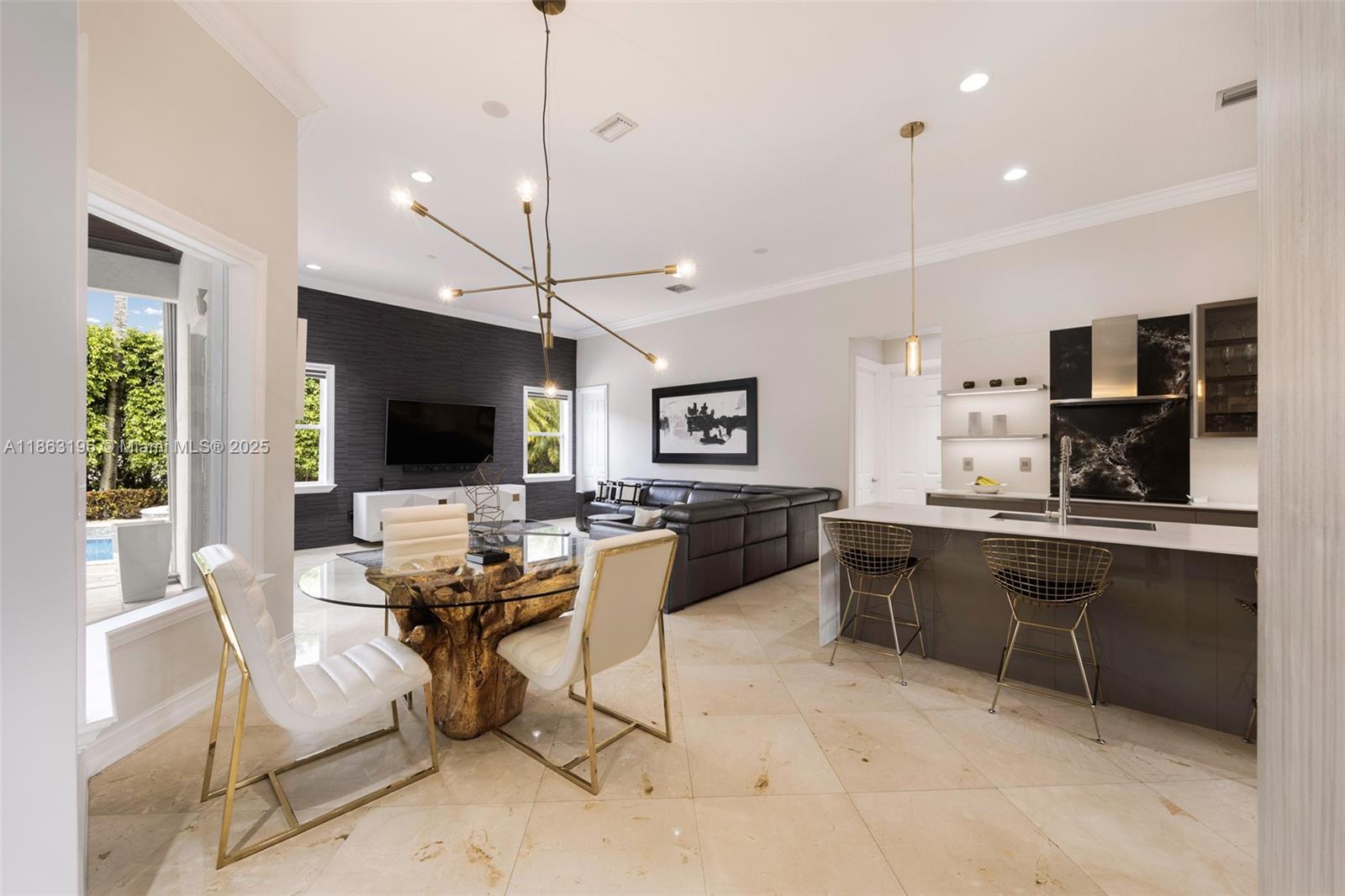 9445 Southwest 68th Street Miami, FL 33173 - Photo 13 of 41 a living room with furniture a flat screen tv and kitchen view