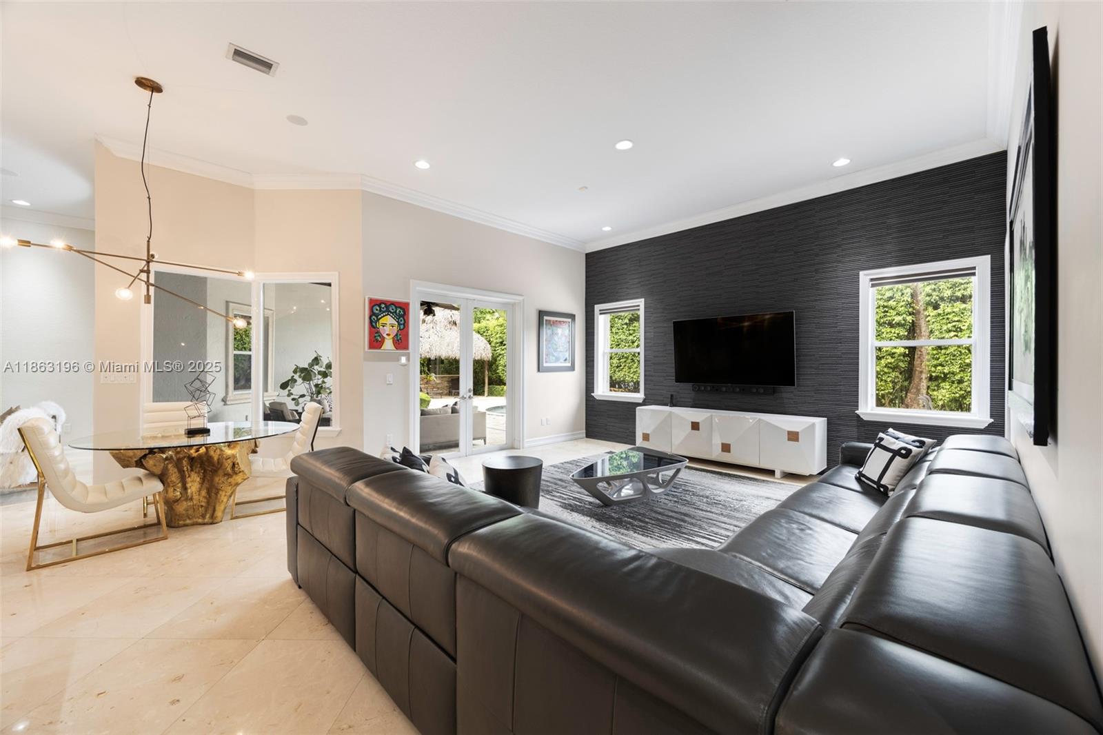 9445 Southwest 68th Street Miami, FL 33173 - Photo 15 of 41 a living room with furniture and a flat screen tv